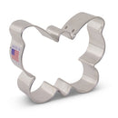 A metal butterfly-shaped cookie cutter with a flag emblem indicating it is made in the USA.