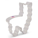 A silver metal cookie cutter in the shape of a llama.