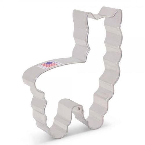 A silver metal cookie cutter in the shape of a llama.