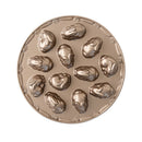 A bronze-colored Nordic Ware pan with bunny molds and featuring a ring of carrots around the edge.