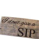Wooden sign with 'I don't give a sip' text on a dark background