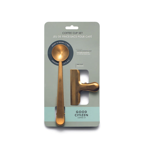 A gold coffee scoop and clip set packaged on a card with the brand name 'Good Citizen'.