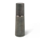 A gray wood style salt mill on a white background.