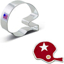 A silver football helmet cookie cutter and a red cookie shaped like a football helmet with a star design.