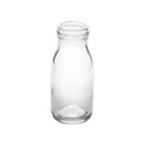 A glass milk bottle on a white background.