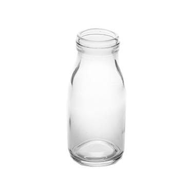 A glass milk bottle on a white background.