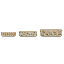A set of three beige stoneware ramekins with a floral pattern, each with a different size.