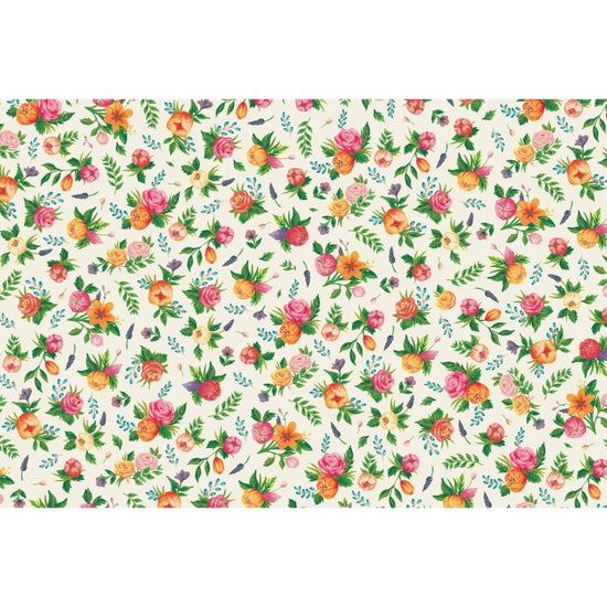 A patterned placemat featuring a floral design with various colors on a beige background.