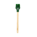 Basting brush with wooden handle and green silicone head with writing on it.