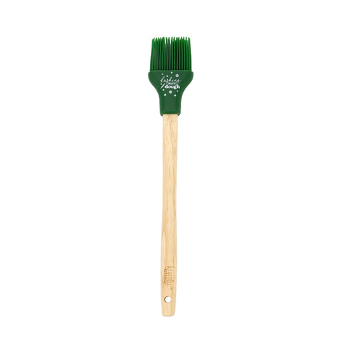 Basting brush with wooden handle and green silicone head with writing on it.
