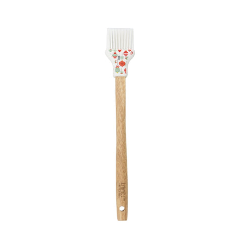 Basting brush with wooden handle and white silicone head with ornament design.