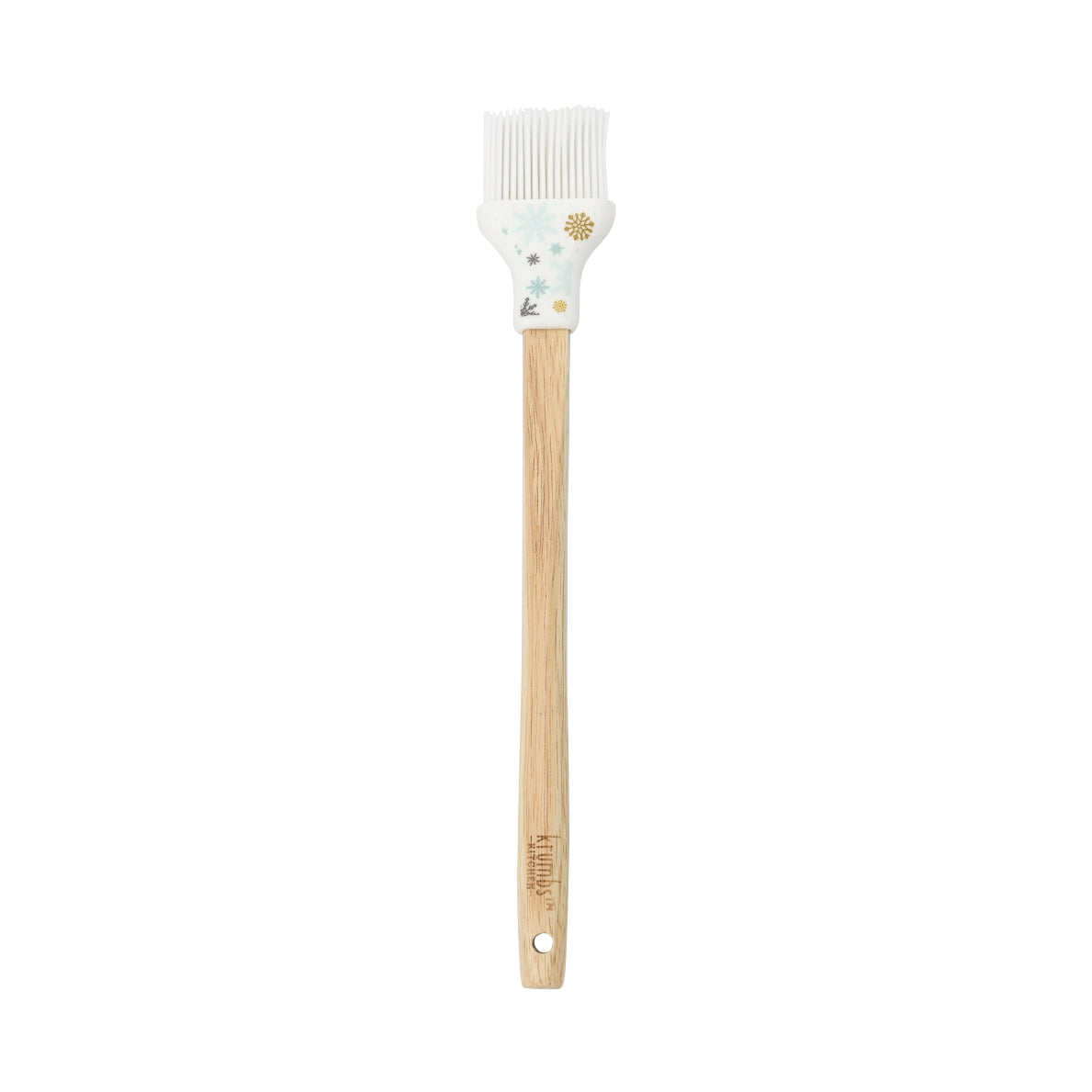 Basting brush with wooden handle and white silicone head with snowflake design.