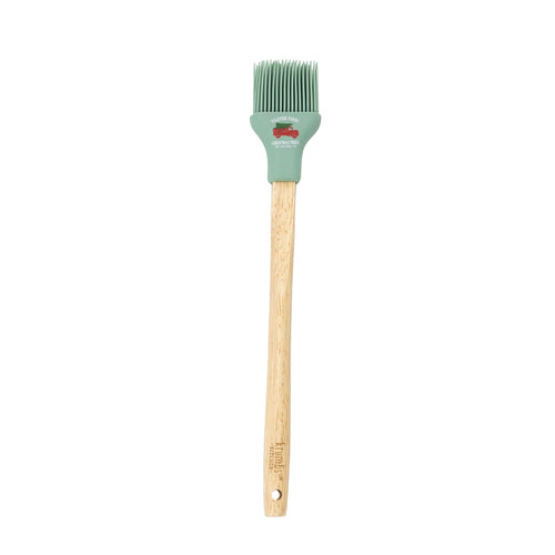 Basting brush with wooden handle and green silicone head with little red truck design.