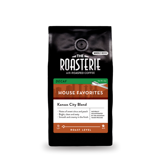 A bag of decaf Kansas City Blend coffee made by the Roasterie on a white background.