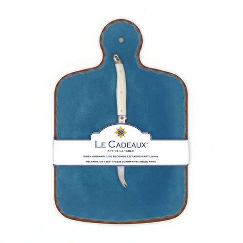 A blue cheese board with a white and yellow floral pattern and a brown knife attached to it, packaged with a label displaying the brand name and product details.