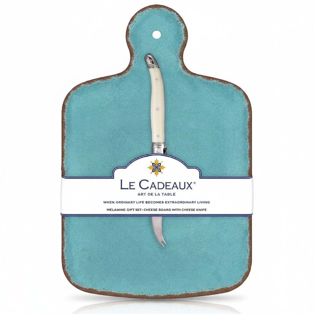 A turquoise cheese board with a white knife attached to it, packaged with a label displaying the brand name and product details.