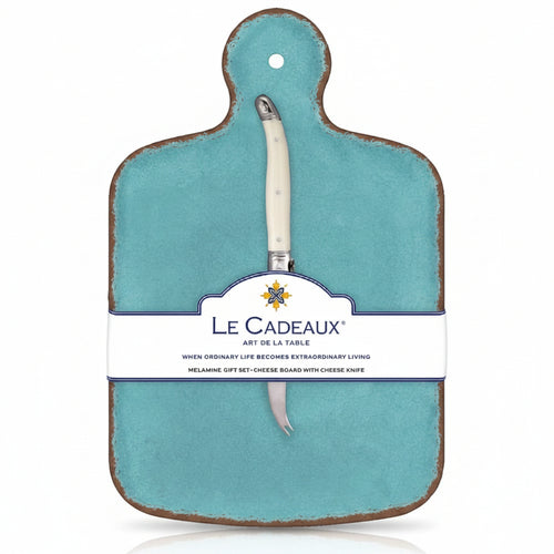 A turquoise cheese board with a white knife attached to it, packaged with a label displaying the brand name and product details.