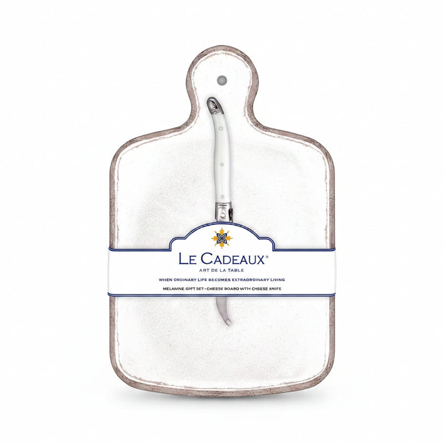 A white cheese board with a white knife attached to it, packaged with a label displaying the brand name and product details.