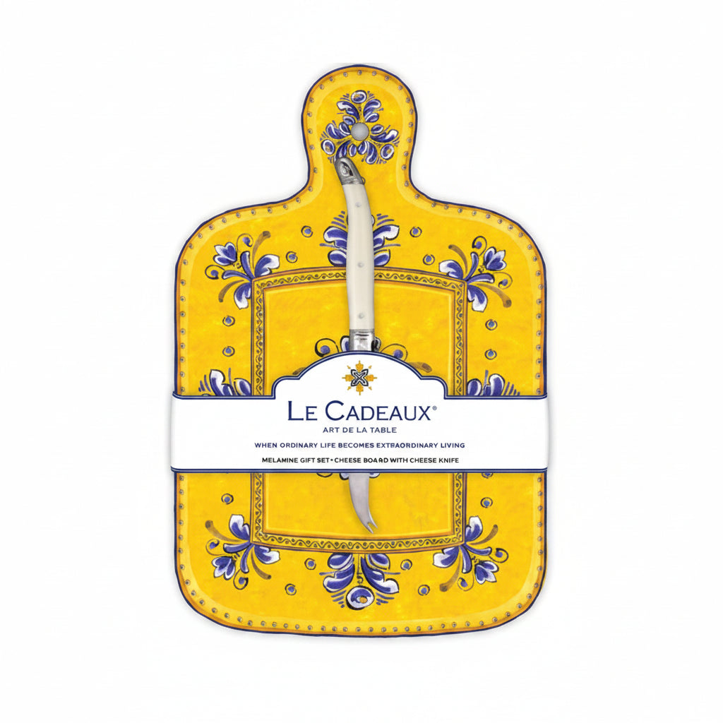 A yellow cheese board with a blue, white, and yellow floral pattern and a white handled knife attached to it, packaged with a label displaying the brand name and product details.