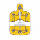 A yellow cheese board with a blue, white, and yellow floral pattern and a white handled knife attached to it, packaged with a label displaying the brand name and product details.