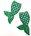 Green mermaid tail cookies on a white background.