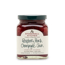A jar of Stonewall Kitchen Raspberry Peach Champagne Jam with the label clearly showing the product name and brand.