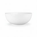 A white, round ceramic serving bowl.